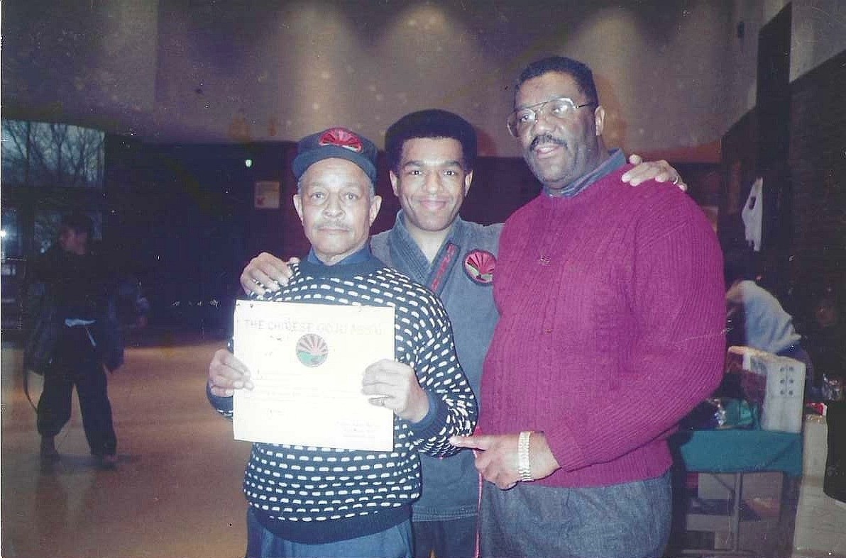 Ernest Webster receiving a community certificate